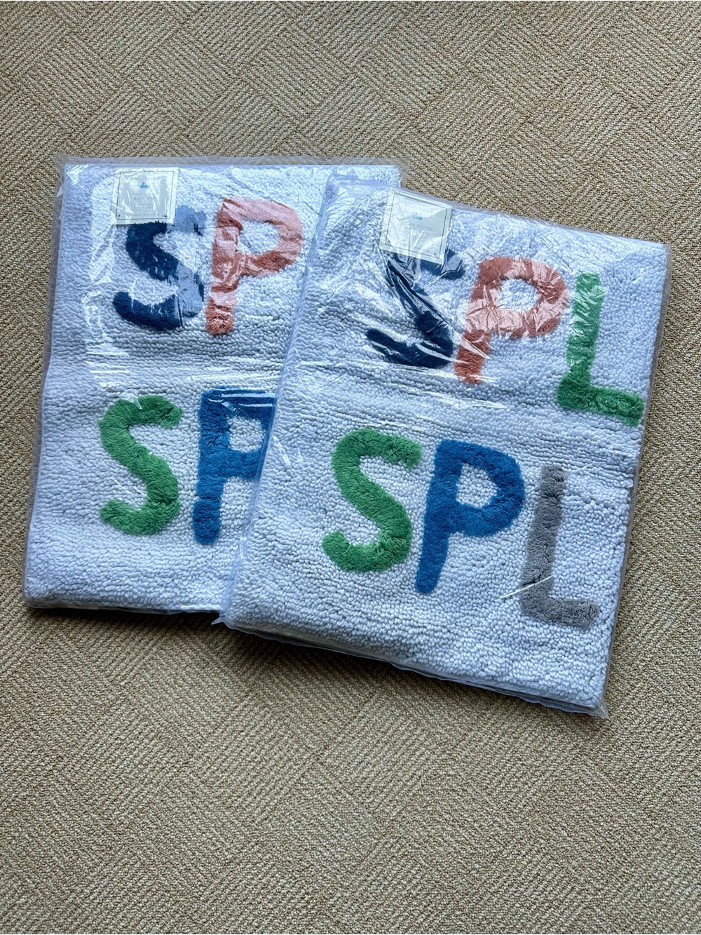 2 Pottery Barn Kids White Bath Mats with Multicolor 'SPLISH SPLASH' Lettering
